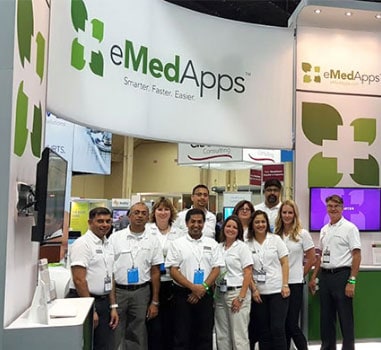 eMedApps team standing in front of booth