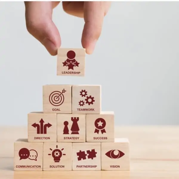 Building blocks with terms related to teamwork written on them